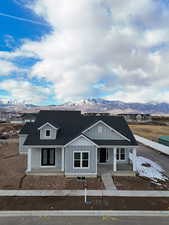 View of front facade featuring a mountain view and a porch