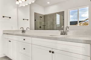 Bathroom with vanity and walk in shower