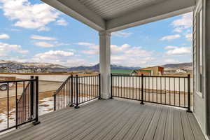 Wooden deck featuring a mountain view