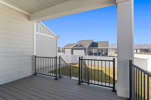 Wooden deck featuring a residential view and a fenced backyard