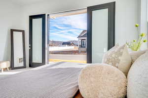 Carpeted bedroom with a mountain view