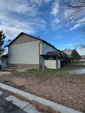 View of property exterior featuring central AC unit