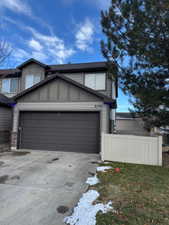 View of side of home featuring a garage