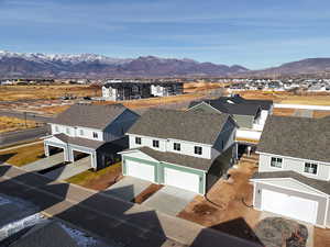 Birds eye view of property with a mountain view