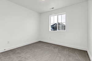 Unfurnished room featuring carpet flooring