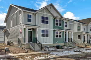 View of front of home featuring central air condition unit