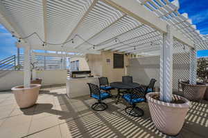 View of patio / terrace featuring a pergola and an outdoor bbq area.