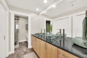 Owner's suite bathroom with large double closets, double vanity, granite countertops.