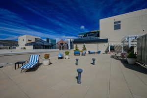 Rooftop area with seating.