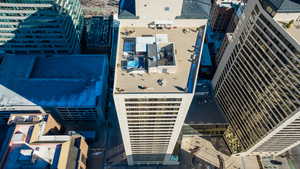 Birds eye view of buildings including roof top hot tub and entertainment area.