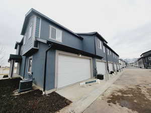 Rear of home with 2 car garage