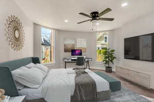 Bedroom with ceiling fan and carpet floors