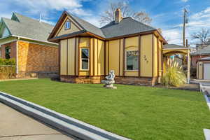 Tudor house featuring a front yard