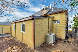 View of side of property with central AC