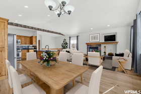 Dining room featuring a chandelier and light wood-type flooring