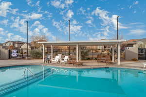 View of swimming pool with a patio area