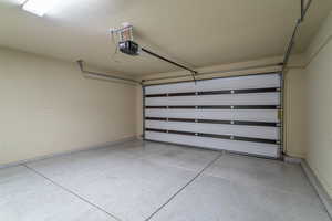 Garage featuring a garage door opener