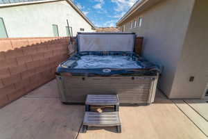 View of patio / terrace with a hot tub