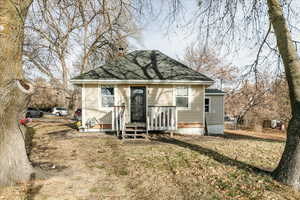 Bungalow-style house with a front yard