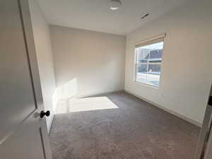 Unfurnished room featuring carpet floors