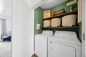 Laundry space with floating shelves.