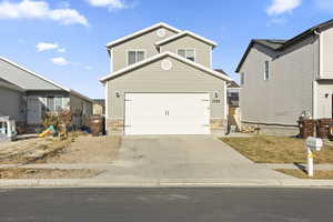 View of front property featuring a garage