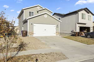 View of property exterior featuring a garage