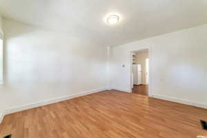 Empty room featuring light wood-type flooring