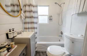 Full bathroom featuring vanity, toilet, and shower / tub combo