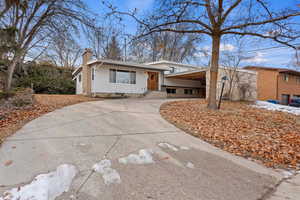 View of front of house with a carport