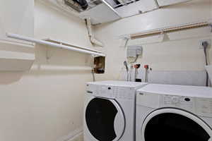 Clothes washing area featuring independent washer and dryer