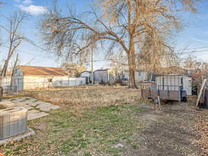 View of yard featuring cooling unit