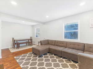 Living room with hardwood / wood-style floors