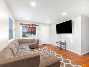 Living room with wood-type flooring