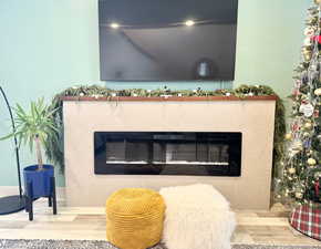 Interior details featuring a fireplace and hardwood / wood-style flooring