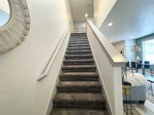 Stairs with a textured ceiling