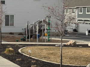 View of playground with a yard