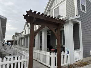 View of property exterior with a pergola