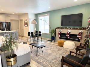 Living room with light hardwood / wood-style floors