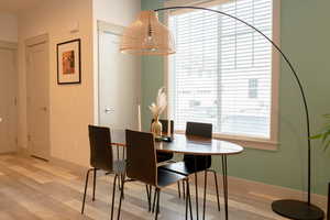 Dining area with light hardwood / wood-style floors