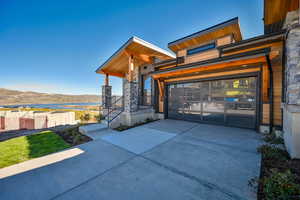 View of front of house featuring a mountain view and a garage