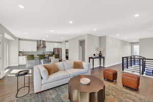 Living room with hardwood / wood-style flooring