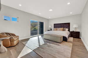 Bedroom featuring access to outside and light hardwood / wood-style floors