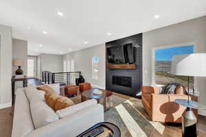 Living room featuring a fireplace and light wood-type flooring