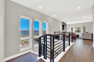 Hallway with hardwood / wood-style flooring