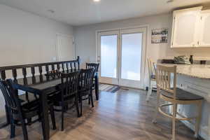 Dining area with wood-style flooring