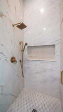 Bathroom with a tile shower