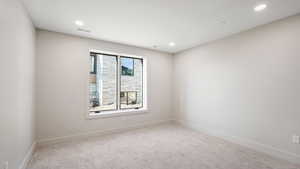 View of carpeted spare room