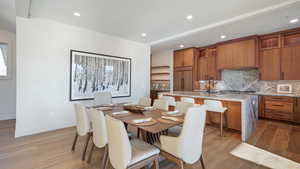 Dining space featuring light hardwood / wood-style flooring and sink