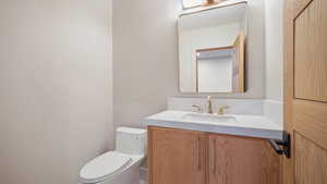 Bathroom featuring vanity and toilet